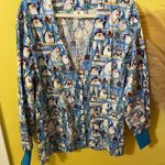 Peaches Uniforms Penguin Print Shirt with Blue and Yellow Accents Photo 0