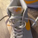 Nike Gray and Yellow Sneakers with Classic Swoosh Photo 2