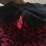 Urban Outfitters RED GEOMETRIC VELVET PEPLUM BOW TOP Photo 1