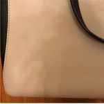 Kate Spade Cream and Black Large Leather Satchel Handbag with Crossbody Strap. Photo 3
