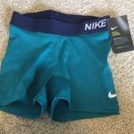 Nike Pro woman’s size XS teal and navy shorts Photo 7