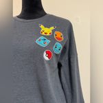 Pokémon EUC Pokemon Gray Sweater with Pokemon Patches size medium Photo 2
