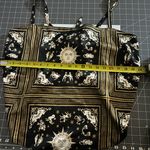 Danielle Bernstein  Black and Gold Zodiac Print Blouse Photo 1