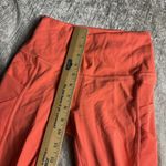 Lululemon  Rise and Flow Pant Mesh Criss Cross Size 4 Orange Coral EUC Photo 3