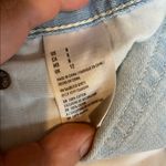 American Eagle  Hi-Rise Festival Size 8 Light Wash Distressed Denim Shorts. Photo 4