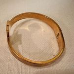 Closed Hinge Gold Tone Bangle Photo 1