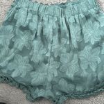 Sage green dressy shorts with lace trim Photo 3