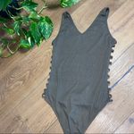 onetheland bodysuit cutout side detail Photo 5