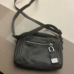 Nicole Miller Black Bag with Adjustable Strap and Rectangular Shape Photo 1