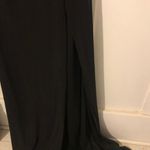 back with gold sparkly sparkles on it and open thigh dress Black Size 8 Photo 5