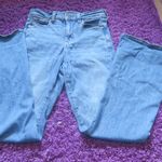 American Eagle Outfitters next level stretch super hi-rise flare jeans in medium wash blue size 4. Photo 1