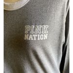 Victoria's Secret -PINK NATION-LONG SLEEVE GRAY TOP-SIZE LARGE Pink Nation logo on front and large Pink Nation on the back. Excellent condition Mead: Bust: armpit to armpit 22 inches Length: shoulder seam to bottom 25 1/2 inches Photo 2