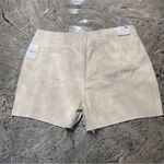 Forever 21 Mid-Rise Raw-Cut Denim Shorts
Size 34
Color is light beige
Brand is  Photo 3