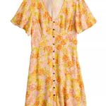 Rewind Button Front Flutter Sleeve Skater Dress
in orange and yellow florals Photo 0
