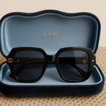 Gucci Black Sunglasses with Gold Detail Photo 0