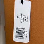 We Wore What ‎ Nylon Biker Short in Gold Photo 5