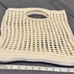 None handmade cream-colored, open-knit crochet tote bag with built-in handles. Photo 0