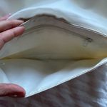 White/cream clutch cute for going out, put your hand through the ring for ease White Photo 3