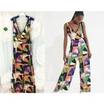 Urban Outfitters  Bold Patchwork Jumpsuit Crossover Deep V Size 4 Orange Black Photo 1