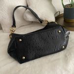 Black and Gold Shoulder Bag with Luxurious Texture Photo 2
