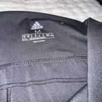 Adidas  Women’s Athletic Sports leggings in black. EUC. Size Medium. Photo 2