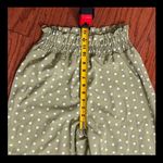 SheIn Olive Green high waste Polk dot wide leg pants - Size Small with Bag. Gently warn once and excellent condition. Measurements approximately 12” waste not fully stretched out from elastic waste band x 12” rise x 43” long. None smoking home. Priced to sell at as is condition. Don’t like my price, make reasonable offer. Photo 5