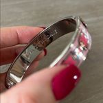 Halcyon Days Chain enamel hinged bangle in a pink and gold colorway. Silver Photo 2