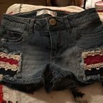 No Boundaries Stylish denim shorts featuring red and white patchwork details. Perfect for casual wear and the 4th of July!  Photo 0