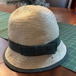 World Market woven raffia straw cloche hat with an olive green polka Photo 0