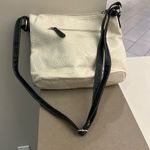 Stone Mountain Versatile White and Black Crossbody Bag with Adjustable Strap Photo 1