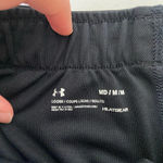 Under Armour EUC |  women’s active‎ heat gear loose fit black/white shorts — med. Photo 3