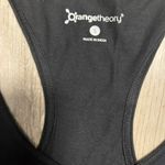 Orangetheory Size S black Racerback tank with skull and cross bones.  Pit to pit is 17, length is 25 Photo 3