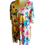 Torrid NWT- Stunning white with bright colorful flowers, babydoll style, ties in front, flutter sleeves, lightweight, the perfect summer top, brand new, size 2x Measurements: Bust: armpit to armpit 25 inches Waist: side to side 22-27 inches Length: shoulder seam to bottom 30 inches Photo 4