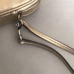Coach gold wristlet/accessory holder Photo 3