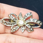 Silver Tone Clear Rhinestone Bow Unsigned Vtg Photo 0
