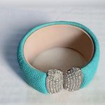 Vtg PJM Blue w/ Silver Tone Cuff Bracelet Signed Marked PJM blue bracelet with Silver tone and clear rhinestones. Bracelet 1 3/8” wide Bracelet measure 6 1/8” around the inside when closed. Good used condition Photo 0