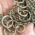 Long silver tone necklace with circles Photo 1