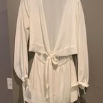 Reverse White Cutout Romper Photo 0