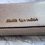 Michael Kors Jet Set Travel Metallic Leather Smartphone Wristlet in Pale Gold Photo 7