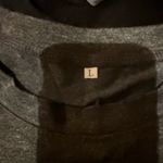 Explore the eerie allure of the Haunted Mansion with this Disney tee. Features a striking graphic in charcoal and neon green. Ideal for theme park enthusiasts. Gray Size XL Photo 1