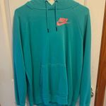 Nike Men's Aqua Hoodie with Pink Logo Photo 0