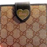 Gucci •  gold heart canvas and leather bifold wallet Photo 0