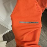 Nike  Dri-Fit Running Quarter Zip‎ Long Sleeve Athletic Top Orange Red Women's Photo 5