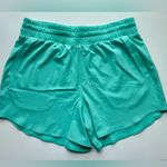 Under Armour Women’s Under Armor Flex Woven 5” Loose Fit Pocket Shorts Light Teal Size L NWT Photo 3