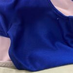 Rebel Athletics Cheer Athletics Practice Wear Sports Bra   Size AS (Adult Small) 13.5 inches from pit to pit when laid flat 12 inches across elastic band when laid flat Elastic band is 1 inch thick  Empower-Mint practice wear   No inserts for cups/pads.  Excellent used condition, no stains, very small pinhole in the mesh area near the neck (photo 3), very small snag on the back pit area (photo 4)  **No cancellations, returns, or exchanges. Please ask all questions before placing an offer or ordering, as I am happy to answer any questions you may have regarding the listing** Photo 3