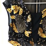 Hot & Delicious dance wear/top. Gold and black Sequined Great condition leotard top Size small Photo 4
