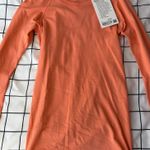Lululemon  Woman’s Coral Long Sleeve Swiftly Tech, Size 2, Hip Length. NWT. Photo 1