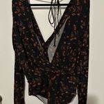 BCBGeneration  Black and Orange Floral Bodysuit Photo 1