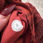 Lululemon  red logo pattern ankle leggings size 8 Photo 6