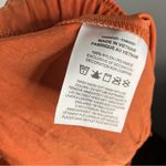 Nike loose fit high rise cargo shorts orange rust women’s size small new casual Photo 10